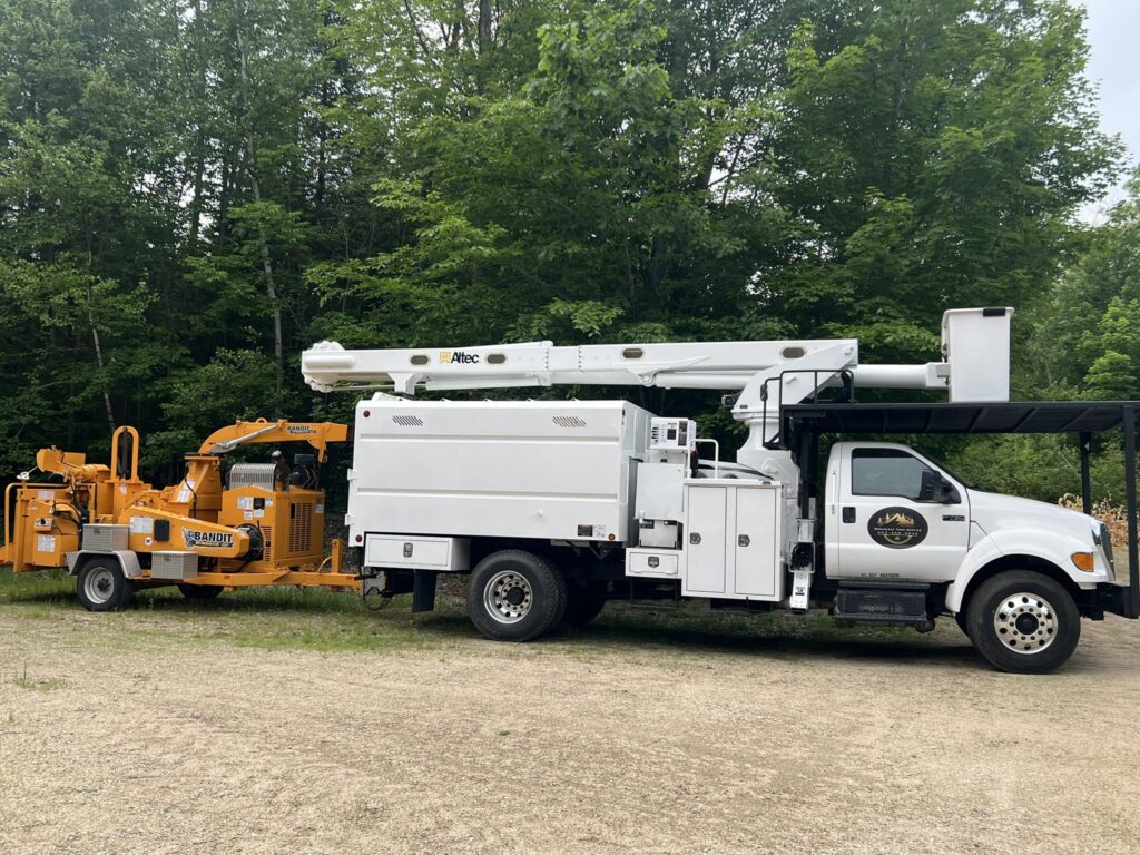 Broadleaf Tree Service bucket truck and wood chipper